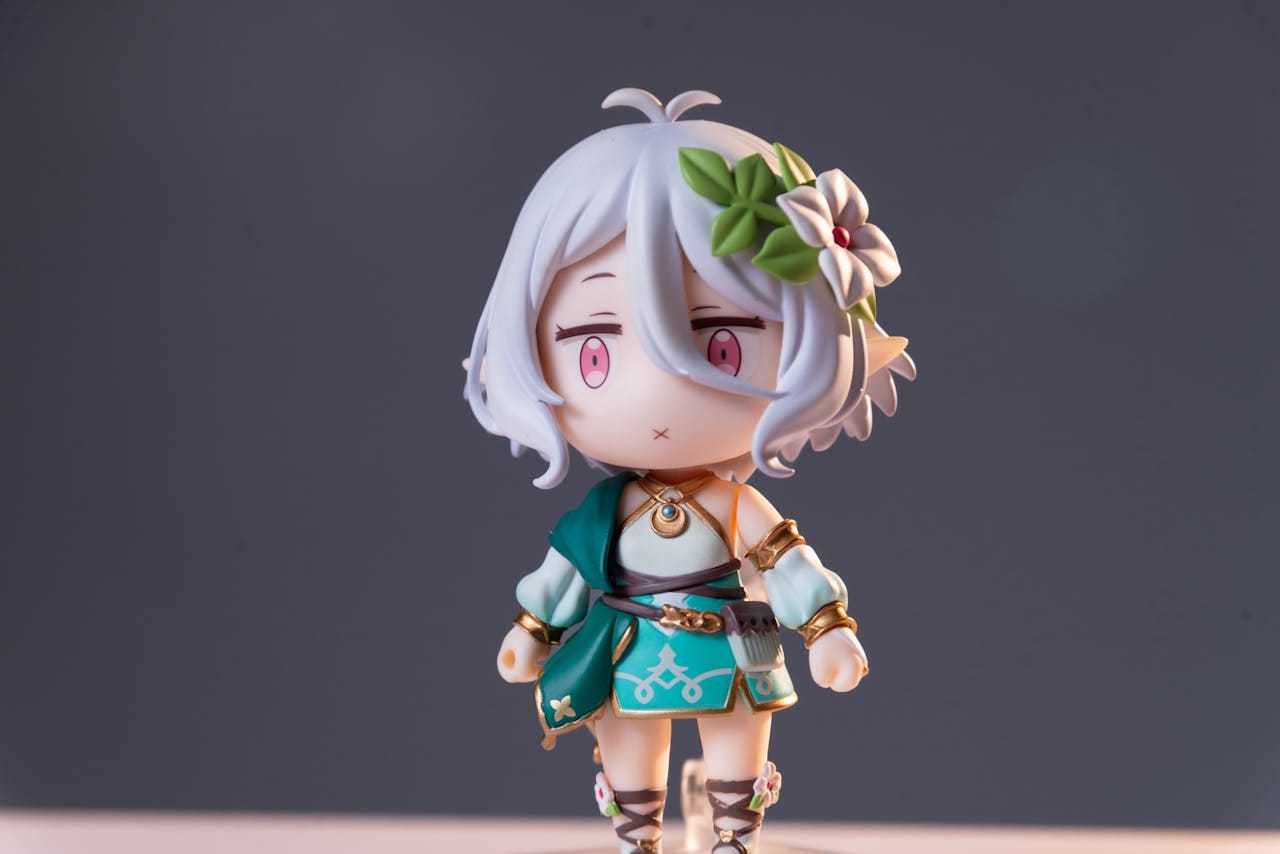 Close-up of an anime figurine featuring white hair and a decorative flower, on a neutral background.